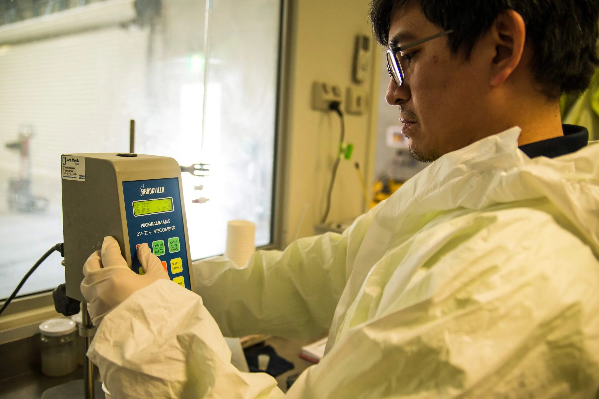 Aqua Technics laboratory technician testing gelcoat viscosity with a Brookfield viscometer