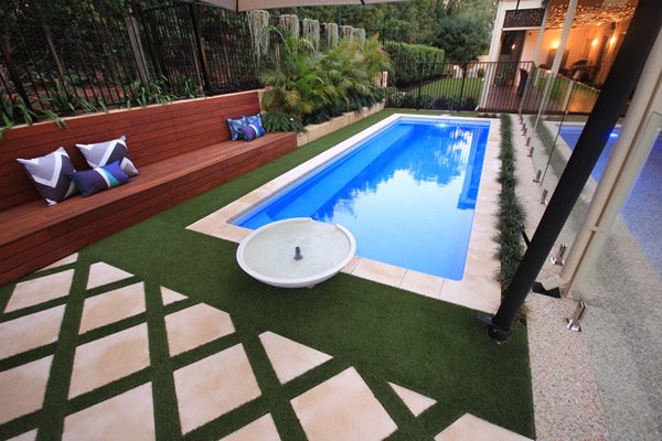 "Bellagio" Fiberglass Inground Swimming Pool, pictured as backyard pool